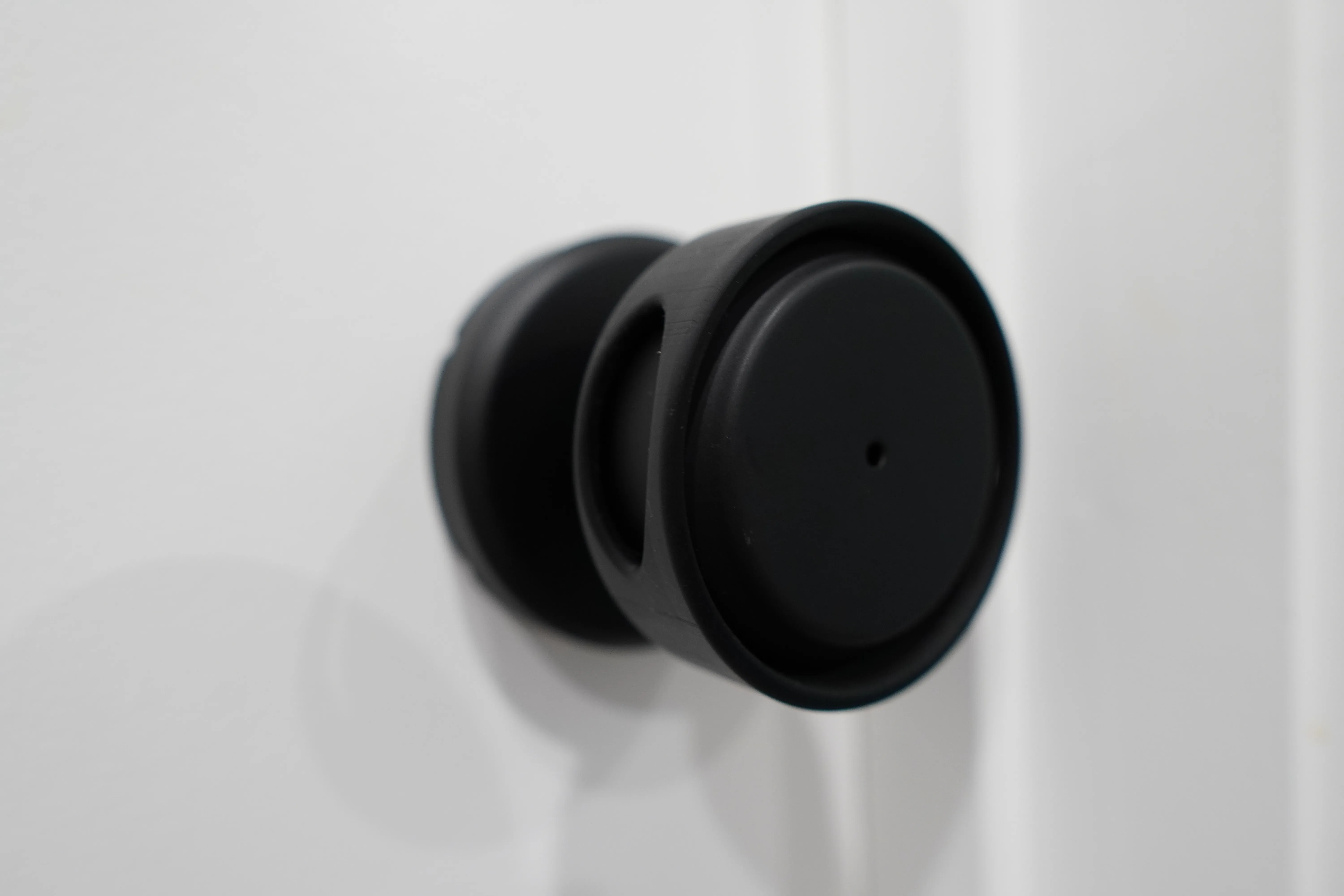 The covered knob at an angle, one side window visible